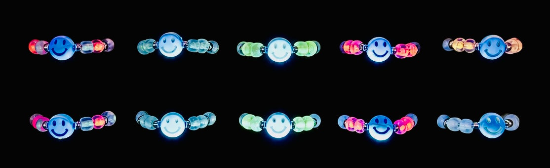 Do Stuff Adjustable Glow Smiley Rings glowing in the dark