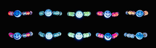 Do Stuff Adjustable Glow Smiley Rings glowing in the dark