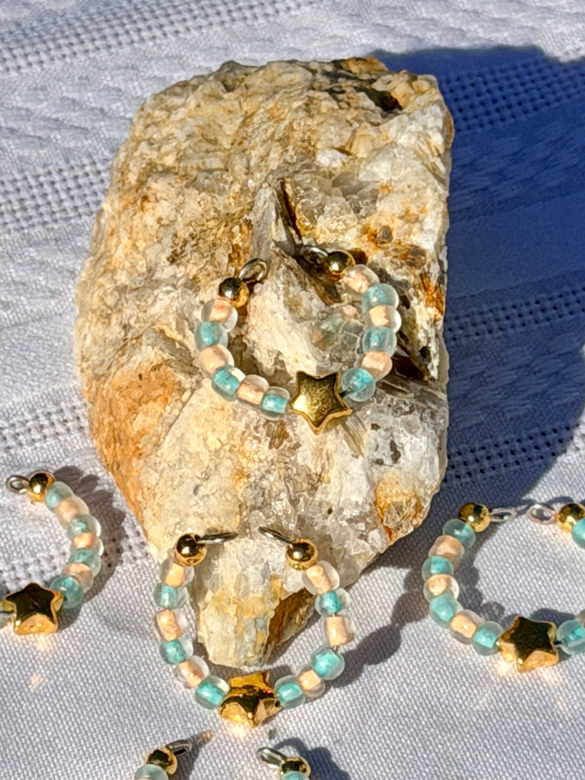 Gold Star Ring close up on rock sunny